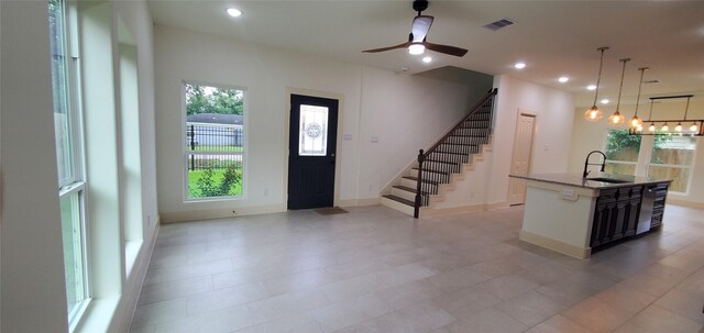 4209 Tampico Rd, Houston, TX 77016 - foyer with a ceiling fan, stairs, recessed lighting, and a chandelier
