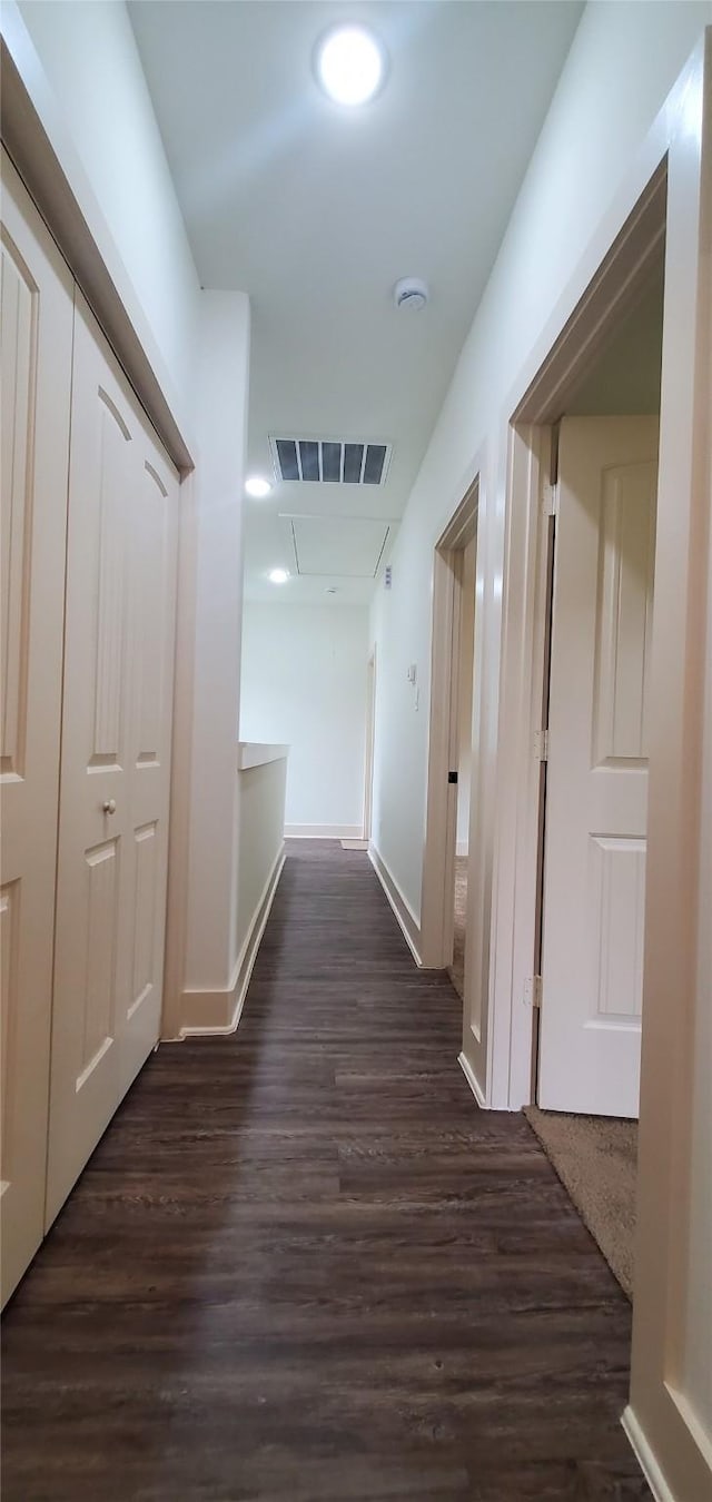 4209 Tampico Rd, Houston, TX 77016 - corridor with dark wood-type flooring and attic access