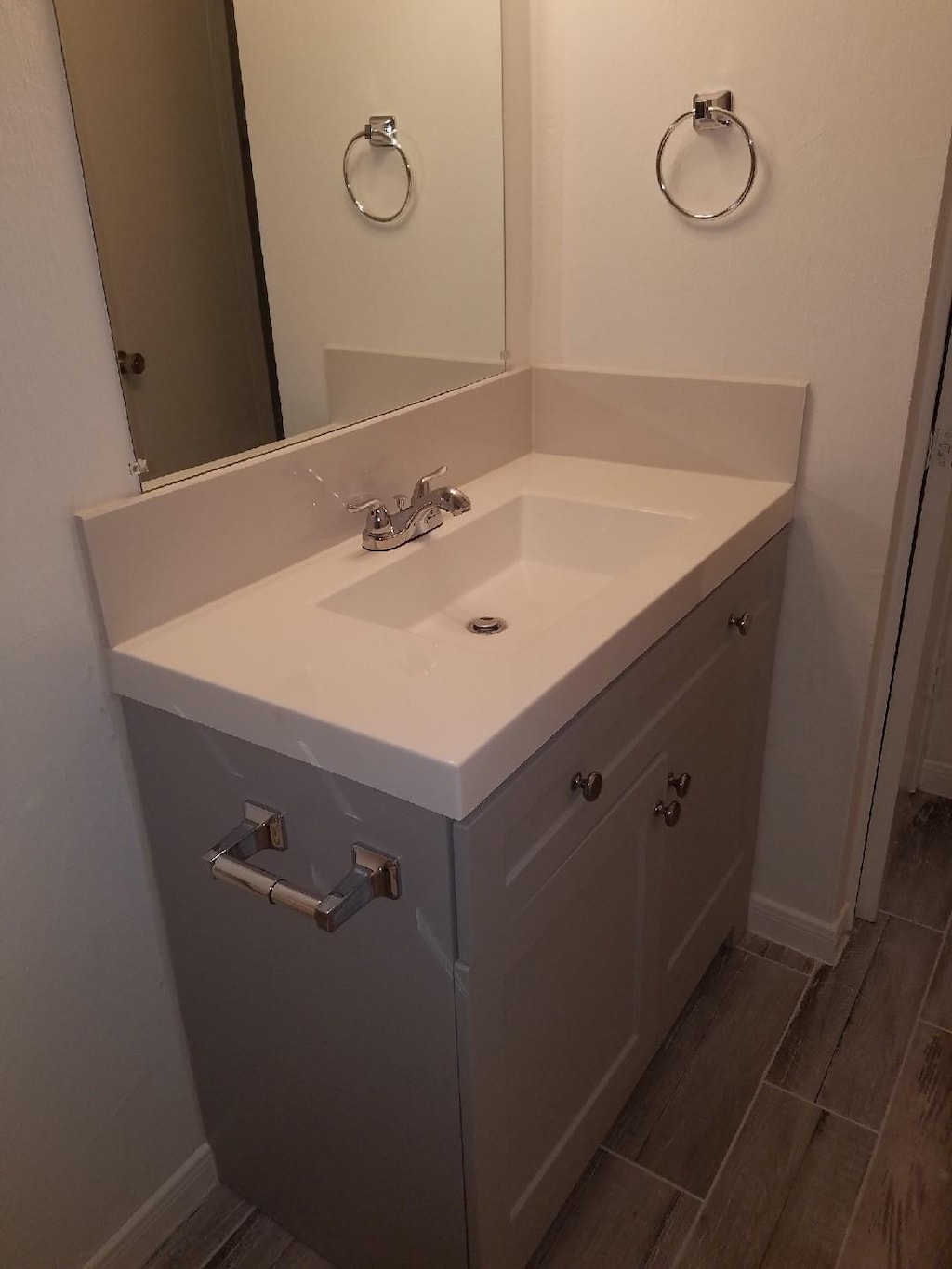 6135 Heatherbrook Dr, Houston, TX 77085 - bathroom featuring vanity and wood tiled floors
