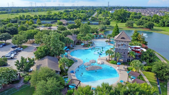 4023 Turning Manor Ln, Sugar Land, TX 77479 - bird's eye view of a pool and a tree filled landscape