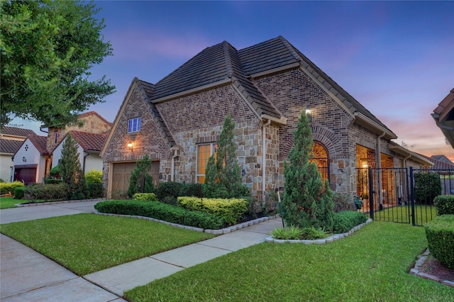 4023 Turning Manor Ln, Sugar Land, TX 77479 - view of front of property featuring concrete driveway, stone siding, and brick siding