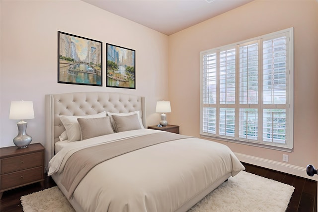 4023 Turning Manor Ln, Sugar Land, TX 77479 - bedroom featuring multiple windows and dark wood-type flooring