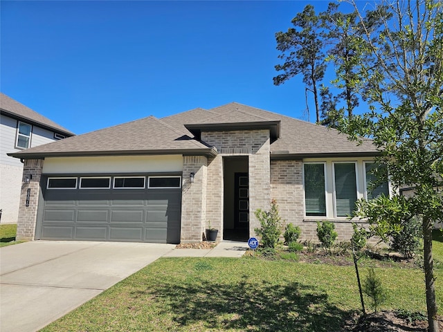 10026 Angelina Woods Ln, Conroe, TX 77384 - view of front of house featuring a garage, brick siding, driveway, a front lawn, and a shingled roof