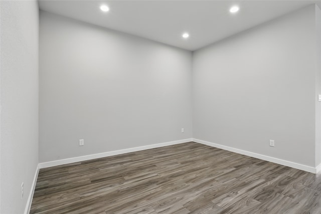10026 Angelina Woods Ln, Conroe, TX 77384 - unfurnished room featuring dark wood-type flooring and recessed lighting