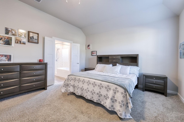 10026 Angelina Woods Ln, Conroe, TX 77384 - carpeted bedroom featuring vaulted ceiling and ensuite bathroom