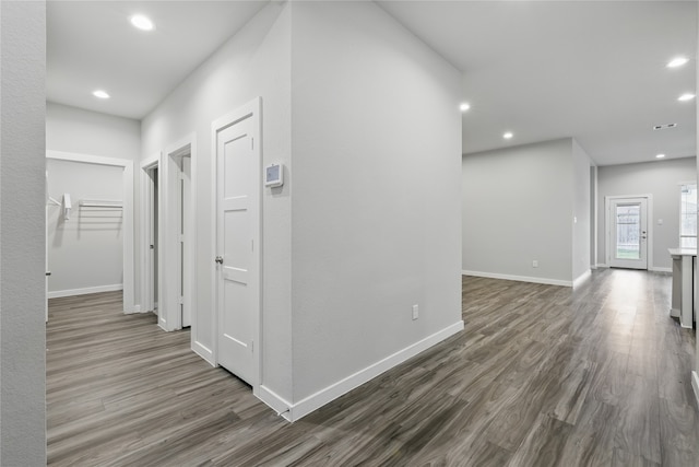 10026 Angelina Woods Ln, Conroe, TX 77384 - hallway featuring dark wood finished floors and recessed lighting