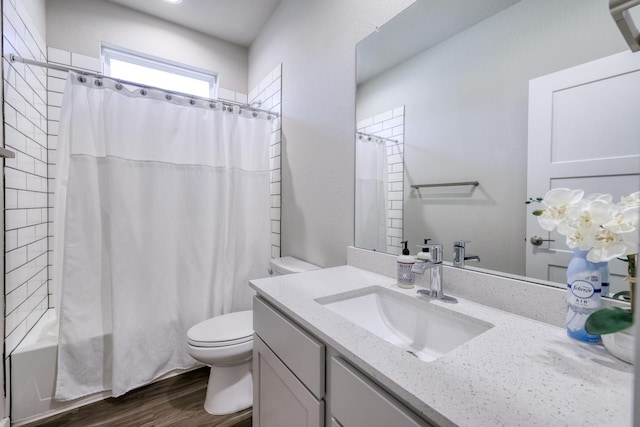 10026 Angelina Woods Ln, Conroe, TX 77384 - full bathroom featuring vanity, shower / bath combo with shower curtain, and wood finished floors
