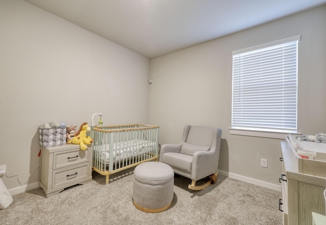 10026 Angelina Woods Ln, Conroe, TX 77384 - bedroom featuring light carpet, a nursery area, and multiple windows