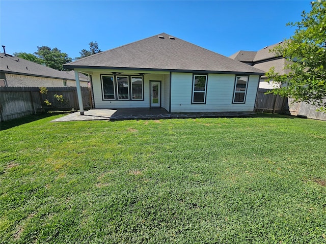 10026 Angelina Woods Ln, Conroe, TX 77384 - back of house featuring a fenced backyard, a patio, and roof with shingles