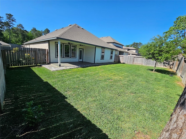 10026 Angelina Woods Ln, Conroe, TX 77384 - rear view of property featuring a patio area, a fenced backyard, and roof with shingles