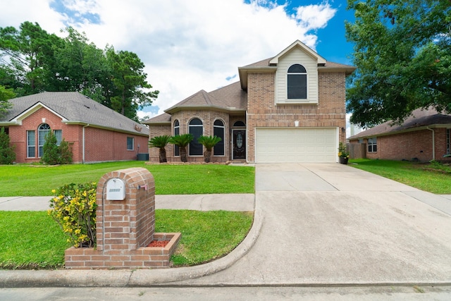 22110 Nobles Crossing Dr, Spring, TX 77373 - view of front of home featuring brick siding, a garage, driveway, and a front yard