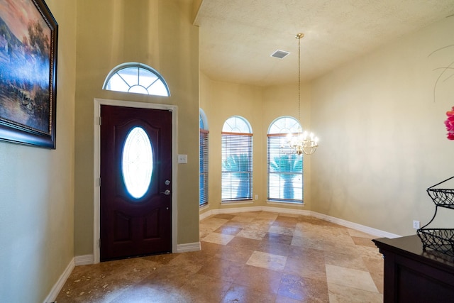 22110 Nobles Crossing Dr, Spring, TX 77373 - foyer featuring plenty of natural light, a chandelier, and a high ceiling