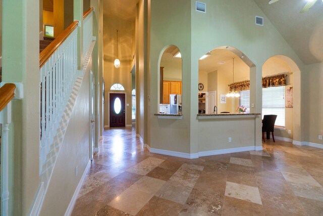 22110 Nobles Crossing Dr, Spring, TX 77373 - foyer entrance featuring a high ceiling and arched walkways