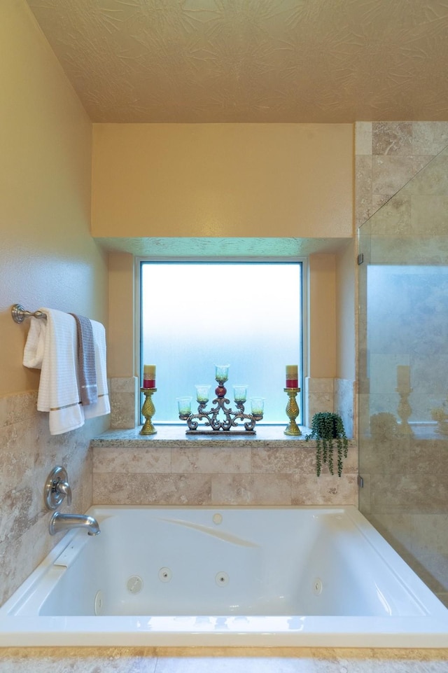 22110 Nobles Crossing Dr, Spring, TX 77373 - bathroom with a tub with jets and healthy amount of natural light