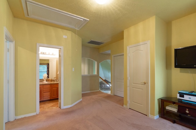 22110 Nobles Crossing Dr, Spring, TX 77373 - unfurnished bedroom with attic access, light colored carpet, and ensuite bath