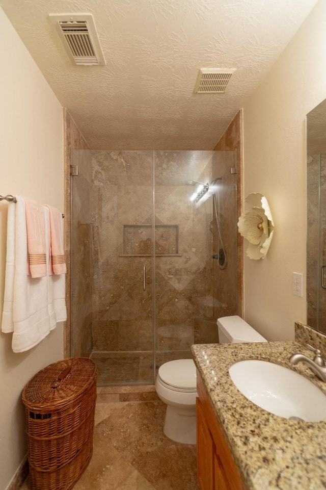 22110 Nobles Crossing Dr, Spring, TX 77373 - bathroom featuring vanity, a shower stall, and a textured ceiling