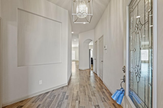 5207 Corbridge Glen Ct, Katy, TX 77449 - foyer entrance with arched walkways, a chandelier, wood finished floors, and recessed lighting