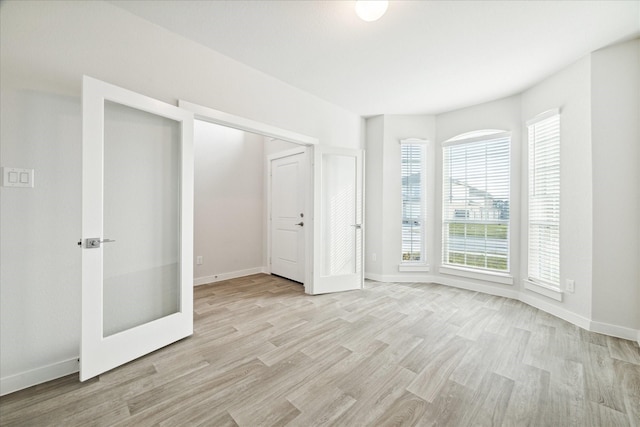 7838 Ruth Ravine Ct, Spring, TX 77379 - unfurnished bedroom with light wood finished floors and baseboards