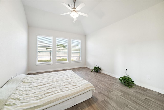 7838 Ruth Ravine Ct, Spring, TX 77379 - bedroom featuring wood finished floors, vaulted ceiling, and ceiling fan