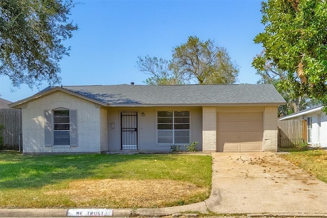 12938 S Coast Dr, Houston, TX 77047 - view of front facade with brick siding, a garage, concrete driveway, and a shingled roof