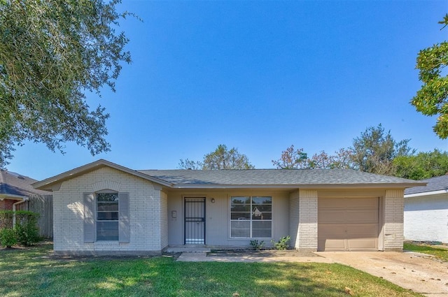 12938 S Coast Dr, Houston, TX 77047 - ranch-style house with brick siding, an attached garage, a front lawn, and concrete driveway