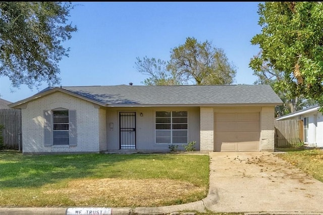 12938 S Coast Dr, Houston, TX 77047 - view of front facade featuring brick siding, an attached garage, driveway, and roof with shingles