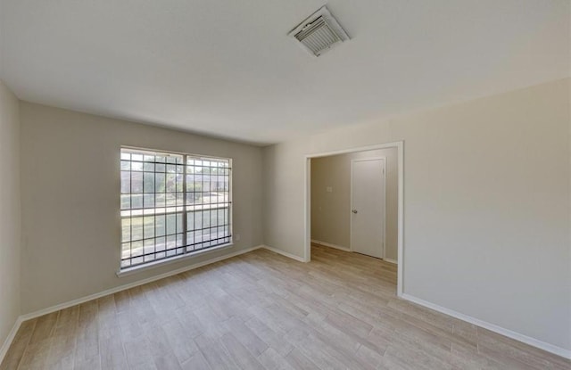 12938 S Coast Dr, Houston, TX 77047 - spare room featuring light wood-type flooring and baseboards