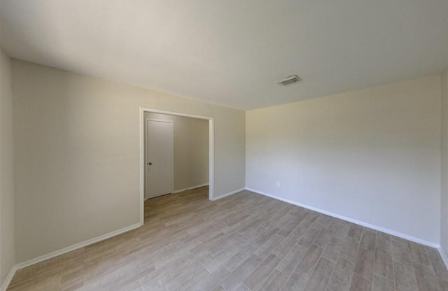 12938 S Coast Dr, Houston, TX 77047 - spare room with light wood-style floors and baseboards