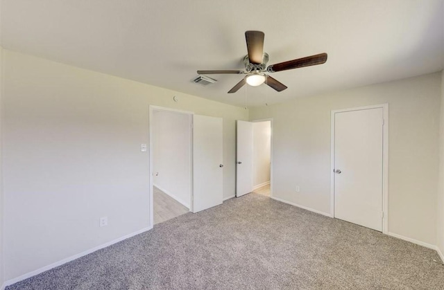 12938 S Coast Dr, Houston, TX 77047 - unfurnished bedroom featuring light colored carpet and a ceiling fan