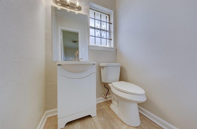 12938 S Coast Dr, Houston, TX 77047 - half bath with a textured wall and wood finished floors