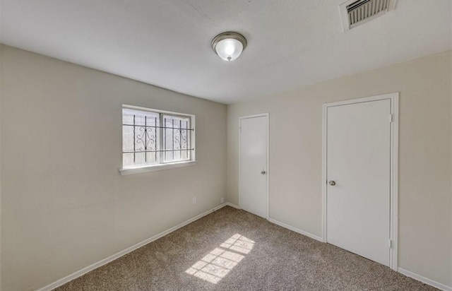 12938 S Coast Dr, Houston, TX 77047 - unfurnished bedroom with carpet and baseboards