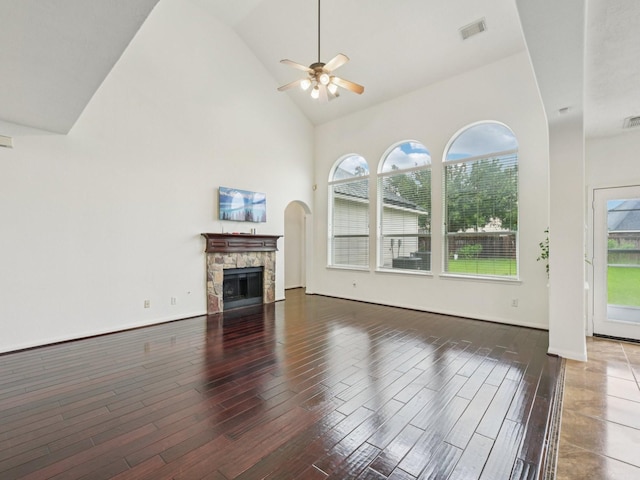 421 White Oak Pointe, League City, TX 77573 - unfurnished living room featuring ceiling fan, high vaulted ceiling, a fireplace, and wood finished floors