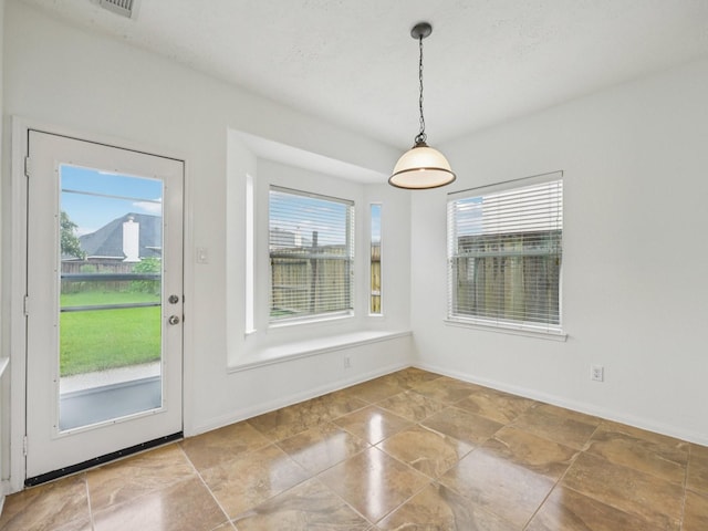 421 White Oak Pointe, League City, TX 77573 - unfurnished dining area featuring baseboards