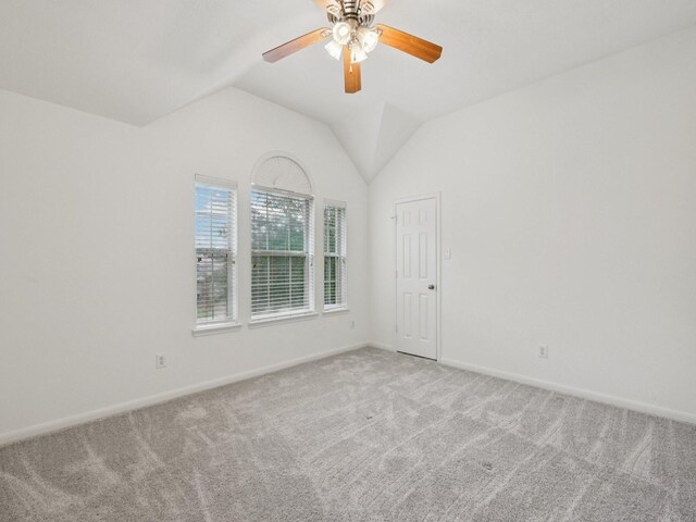 421 White Oak Pointe, League City, TX 77573 - empty room featuring carpet floors, ceiling fan, and vaulted ceiling