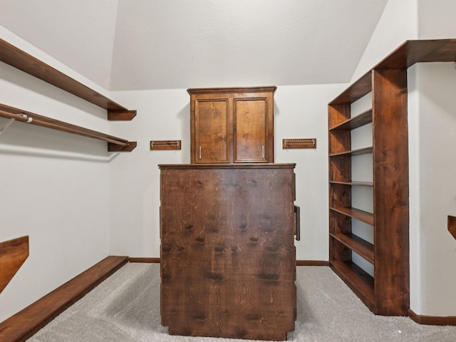 421 White Oak Pointe, League City, TX 77573 - walk in closet featuring vaulted ceiling and carpet flooring