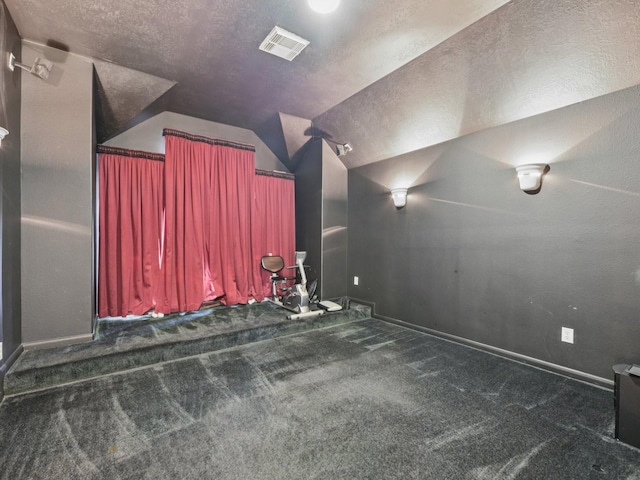 421 White Oak Pointe, League City, TX 77573 - home theater with carpet floors, a textured ceiling, and vaulted ceiling