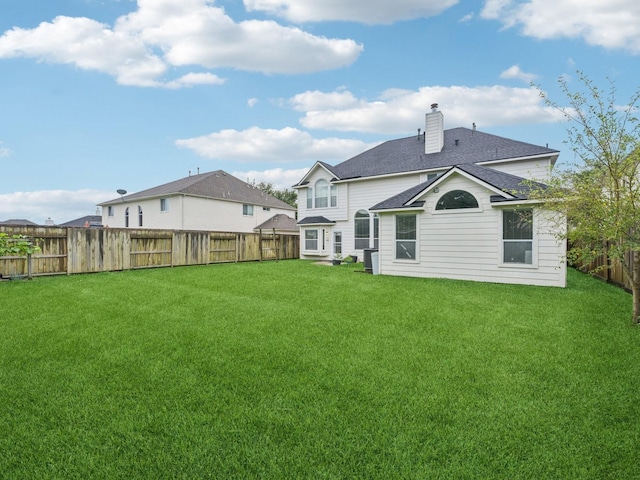 421 White Oak Pointe, League City, TX 77573 - back of property featuring a chimney, a shingled roof, and a fenced backyard