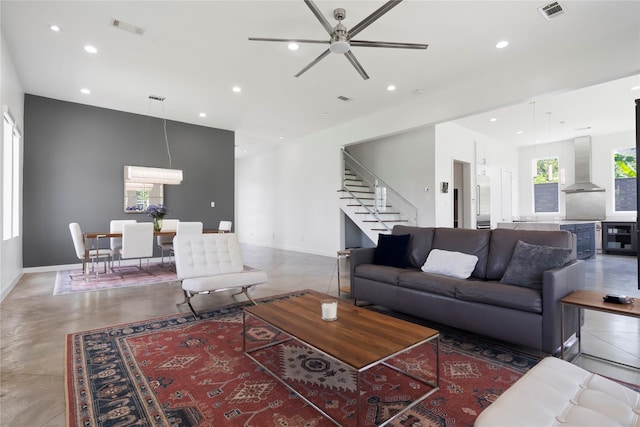 543 Threlkeld St, Houston, TX 77007 - living room featuring stairway, recessed lighting, a ceiling fan, and concrete flooring
