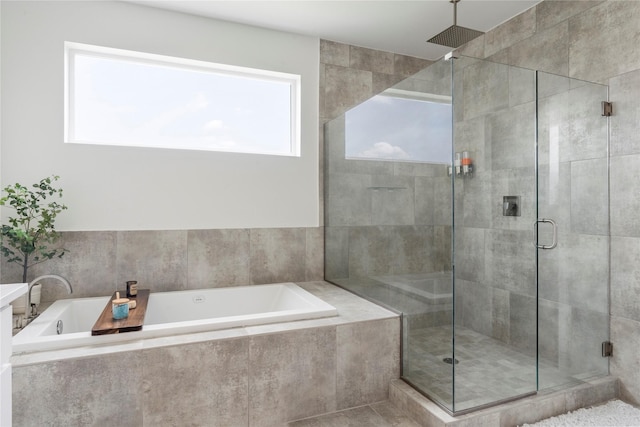 543 Threlkeld St, Houston, TX 77007 - bathroom featuring a stall shower and a garden tub