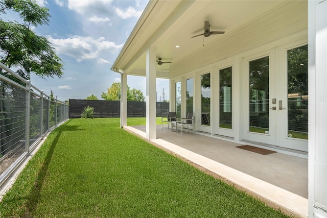 543 Threlkeld St, Houston, TX 77007 - fenced backyard with ceiling fan, a patio area, and french doors