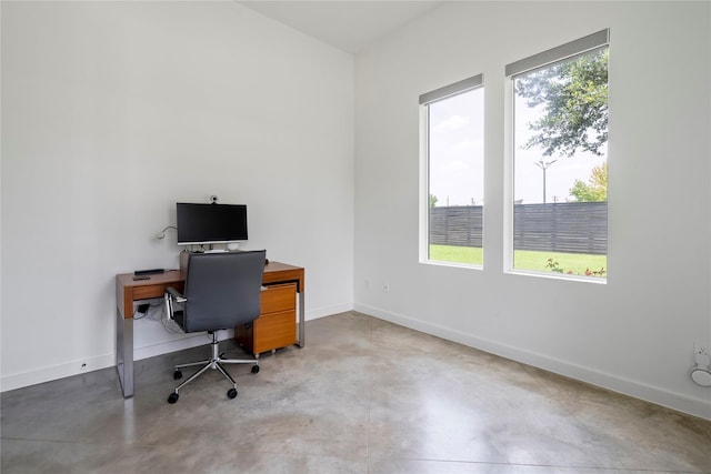 543 Threlkeld St, Houston, TX 77007 - home office with plenty of natural light and finished concrete floors