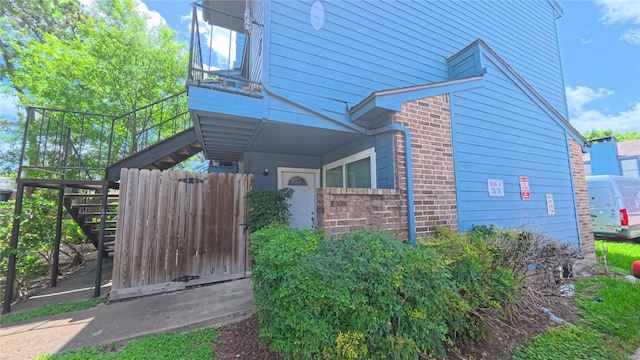 10001 Westpark Dr Unit 29, Houston, TX 77042 - view of side of property featuring stairway and brick siding