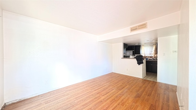 10001 Westpark Dr Unit 29, Houston, TX 77042 - unfurnished living room with light wood-style flooring