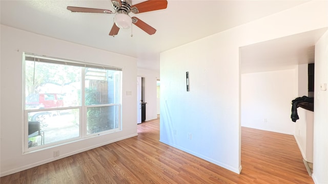 10001 Westpark Dr Unit 29, Houston, TX 77042 - unfurnished room with healthy amount of natural light, light wood-style flooring, and ceiling fan