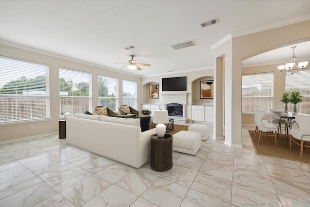 2439 Chuckberry St, Houston, TX 77080 - living room featuring light marble finish flooring, ornamental molding, a chandelier, ceiling fan, and a fireplace with raised hearth