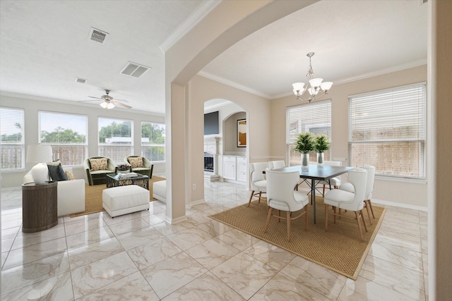 2439 Chuckberry St, Houston, TX 77080 - dining space featuring arched walkways, light marble finish flooring, ornamental molding, a chandelier, and a ceiling fan