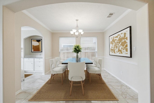 2439 Chuckberry St, Houston, TX 77080 - dining space featuring light marble finish floors, a chandelier, ornamental molding, and arched walkways