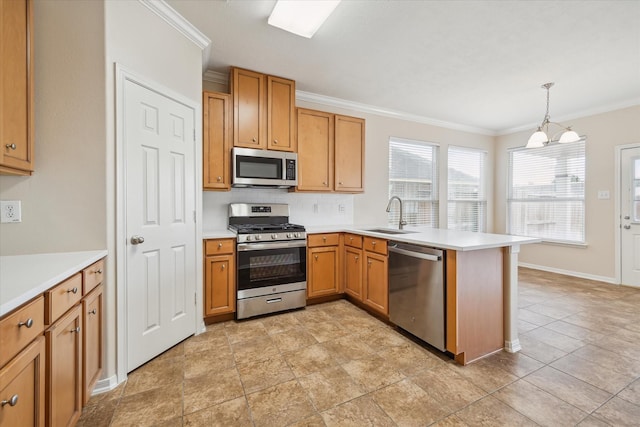 2439 Chuckberry St, Houston, TX 77080 - kitchen with stainless steel appliances, a peninsula, ornamental molding, light countertops, and hanging light fixtures