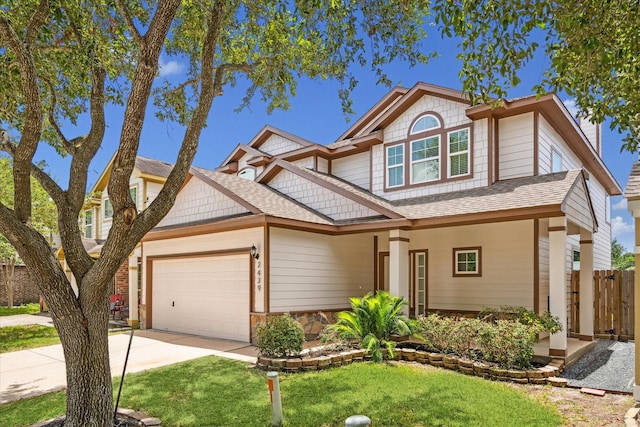2439 Chuckberry St, Houston, TX 77080 - view of front facade featuring a garage, driveway, a shingled roof, and stone siding