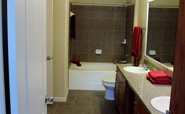 1711 Old Spanish Trl Unit 343, Houston, TX 77054 - full bathroom with double vanity, tile patterned floors, bathtub / shower combination, and a textured wall